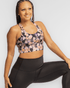 Handful Gametime high-impact sports bra in floral print on black background